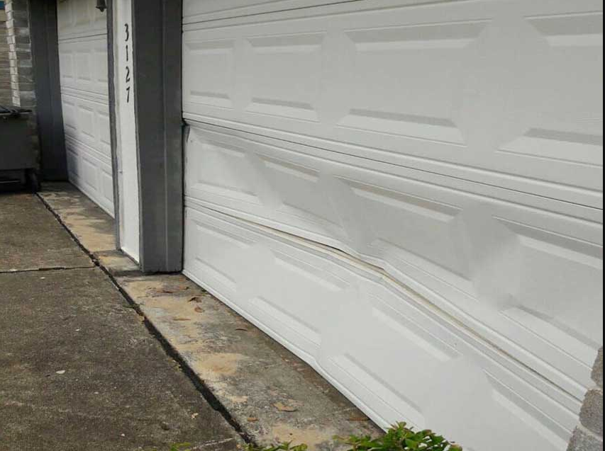 Garage Door Panel Repair in process by expert technician in Myakka City