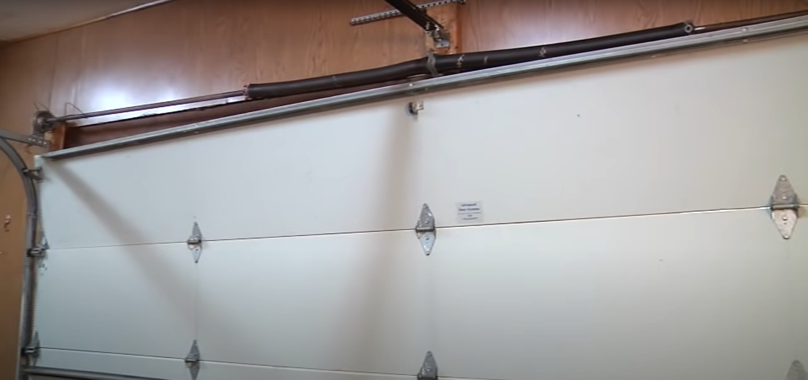 Professional technician from Garage Doors Repair Myakka City repairing a garage door spring to ensure long-term durability.