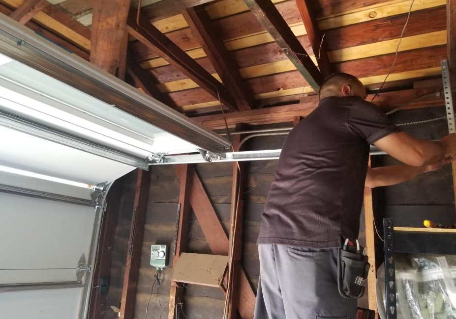 Technician performing garage door opener repair in Myakka City